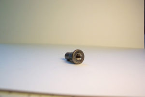 Drilled-tapped-knurled cold headed part